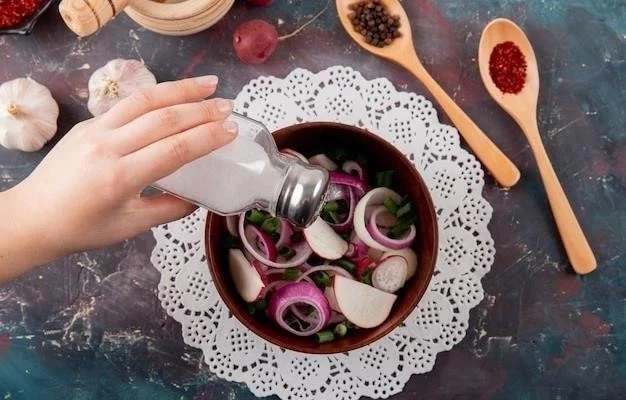top-view-woman-hand-adding-salt-vegetable-salad-with-spices-garlic-green-maroon-background_141793-6004